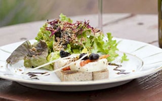 Bruschetta with hot Goat Cheese and Olive Rounds